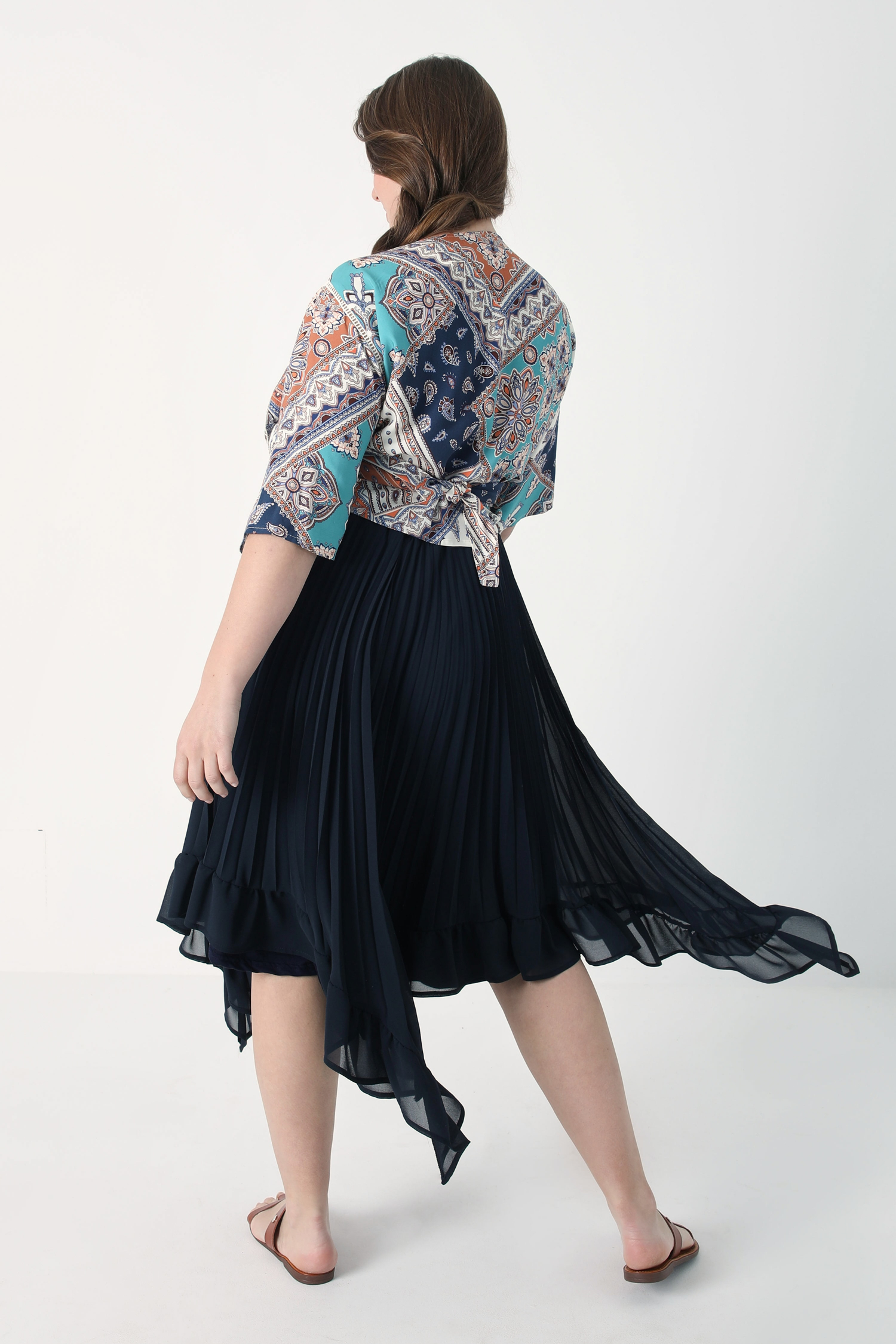 Pleated voile skirt with flounce.
