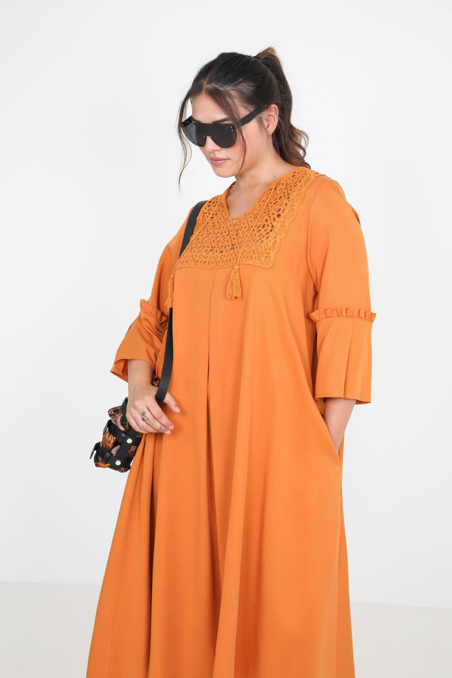 Long plain dress with macramé plastron