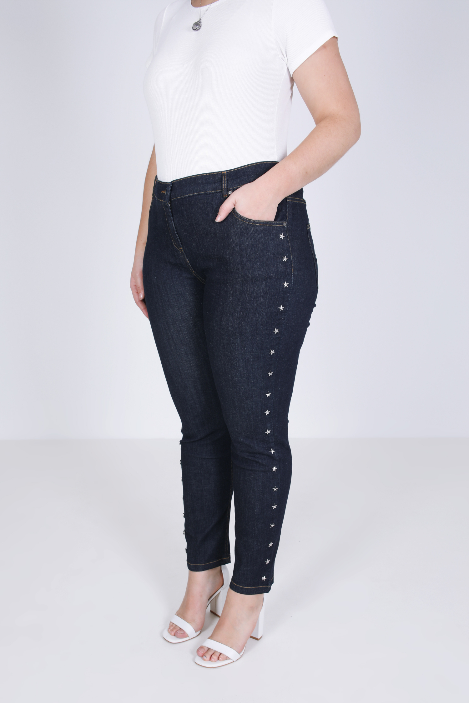 Raw jeans with star-shaped studs