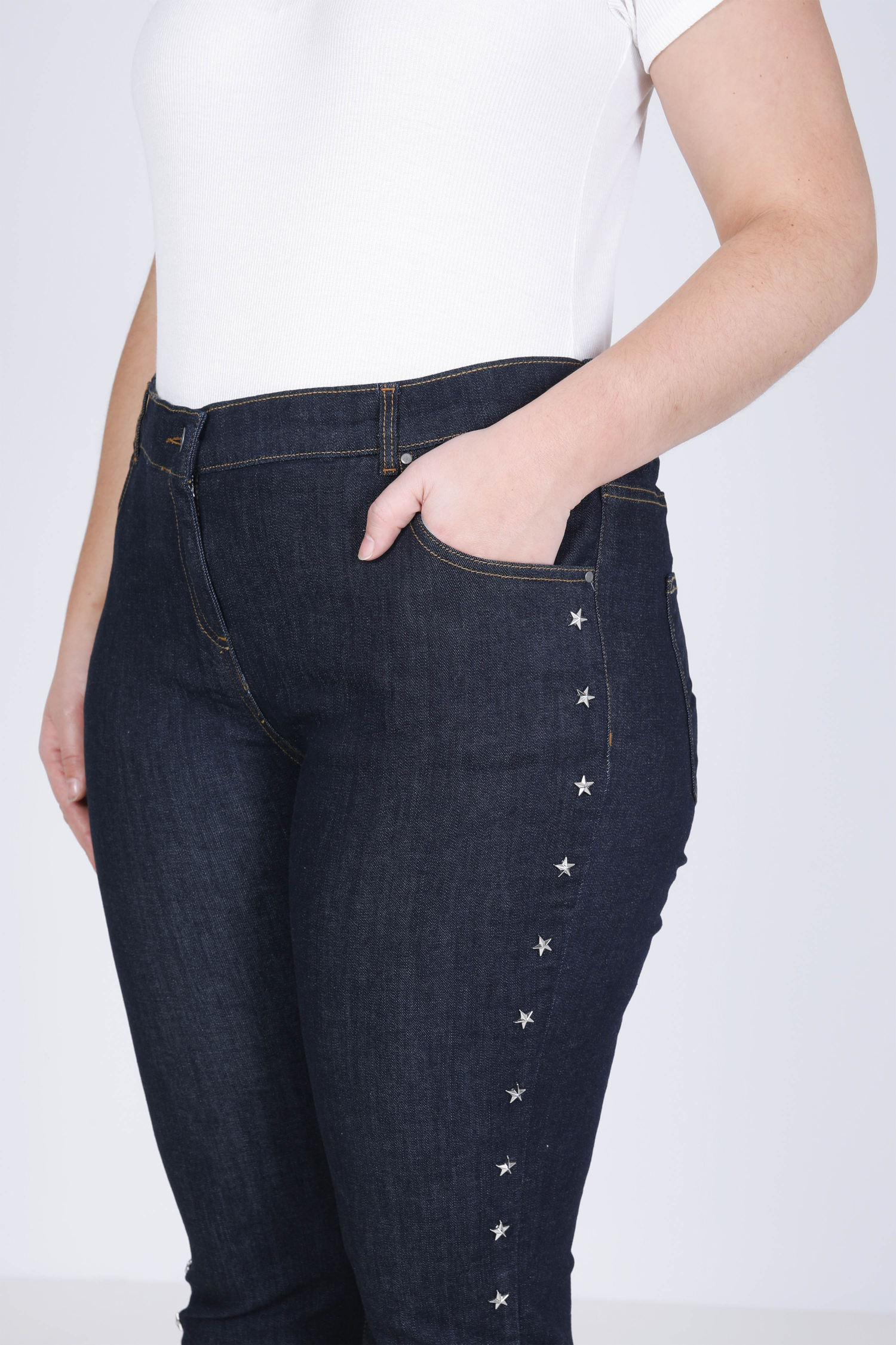 Raw jeans with star-shaped studs