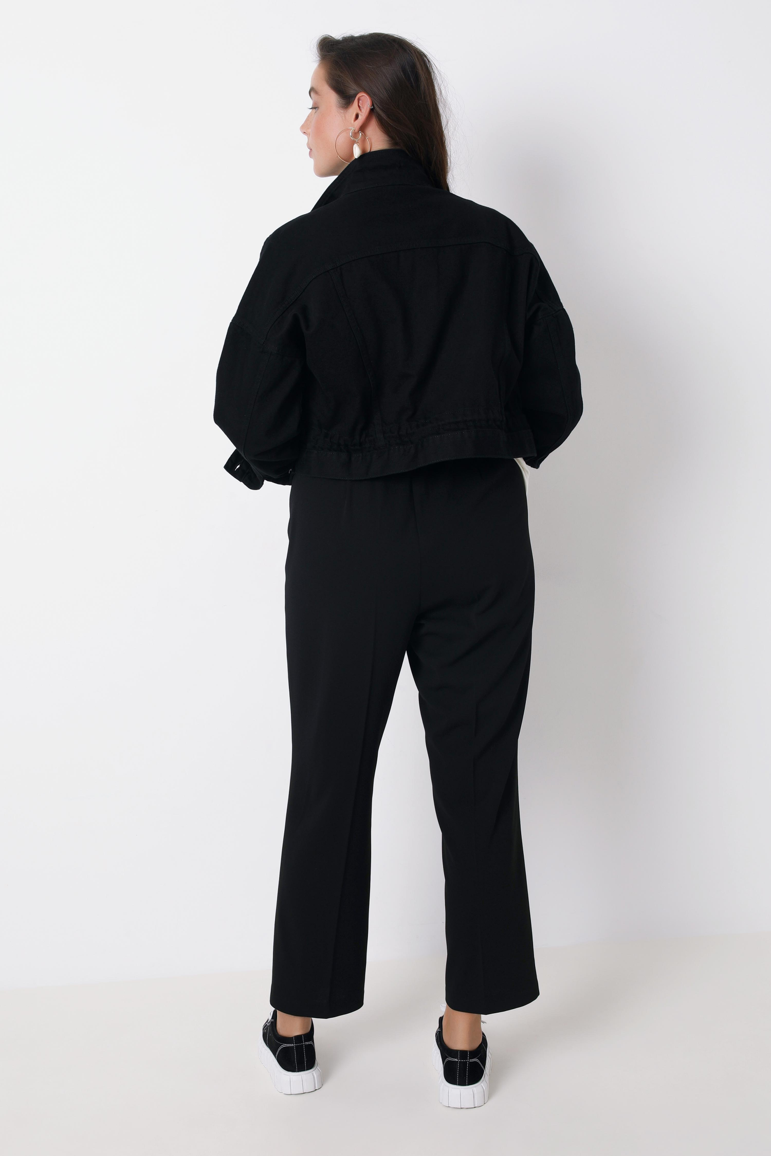 Short black denim jacket with eyelets
