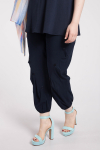 Draped trousers with button decoration