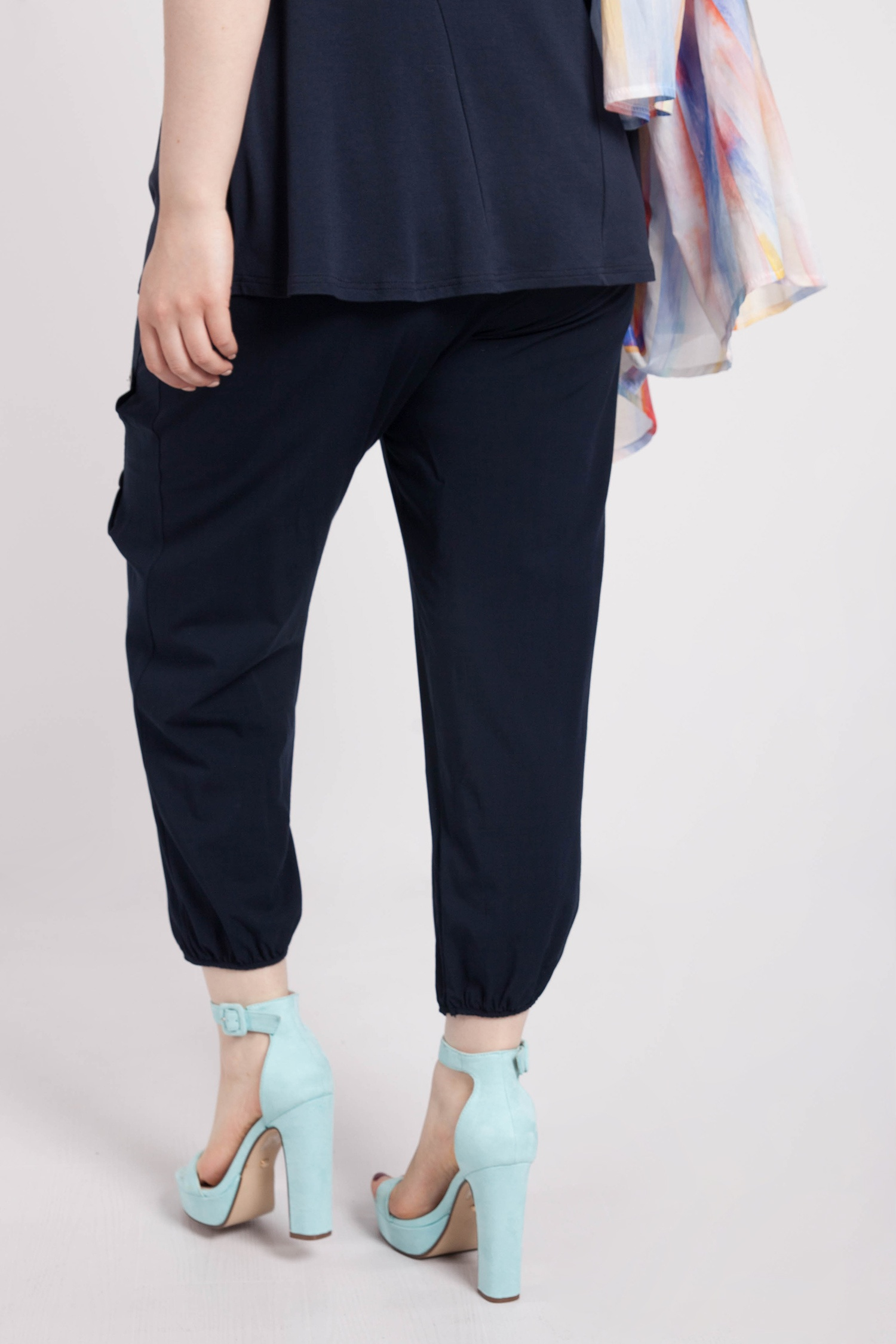 Draped trousers with button decoration