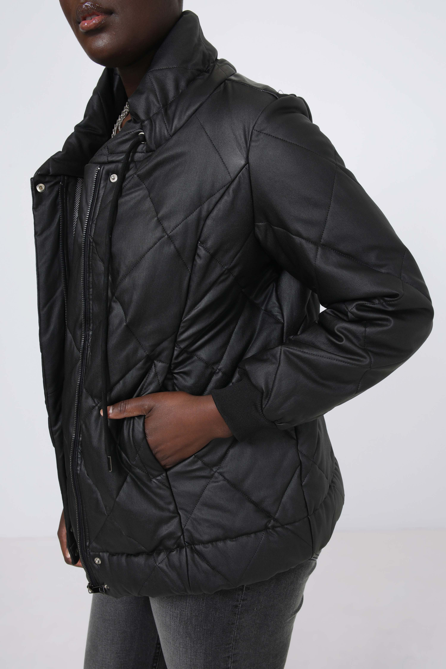 Quilted down jacket in faux leather