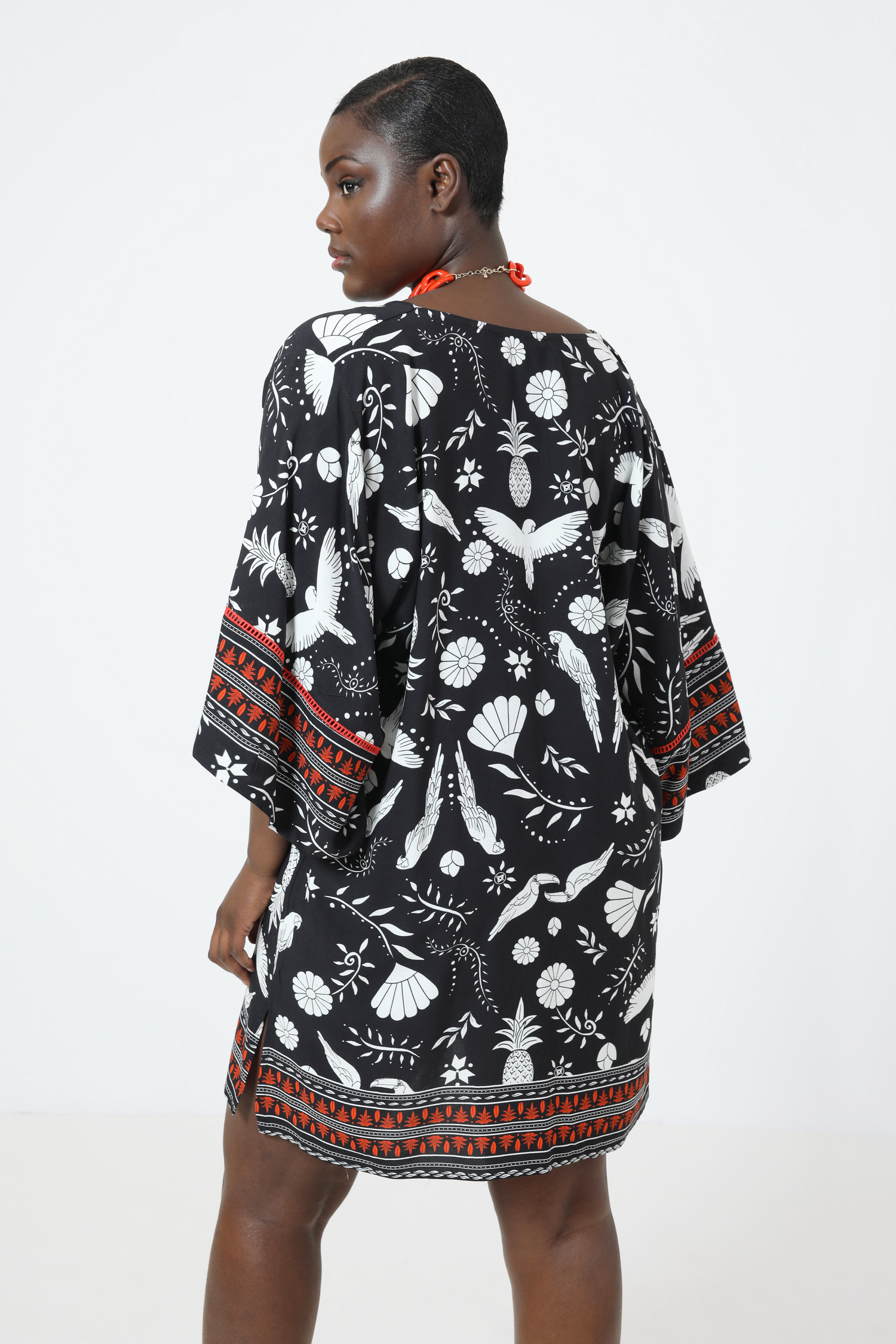 Printed tunic with a design based on