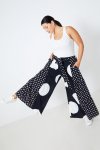 Wide bohemian style pants with polka dots.