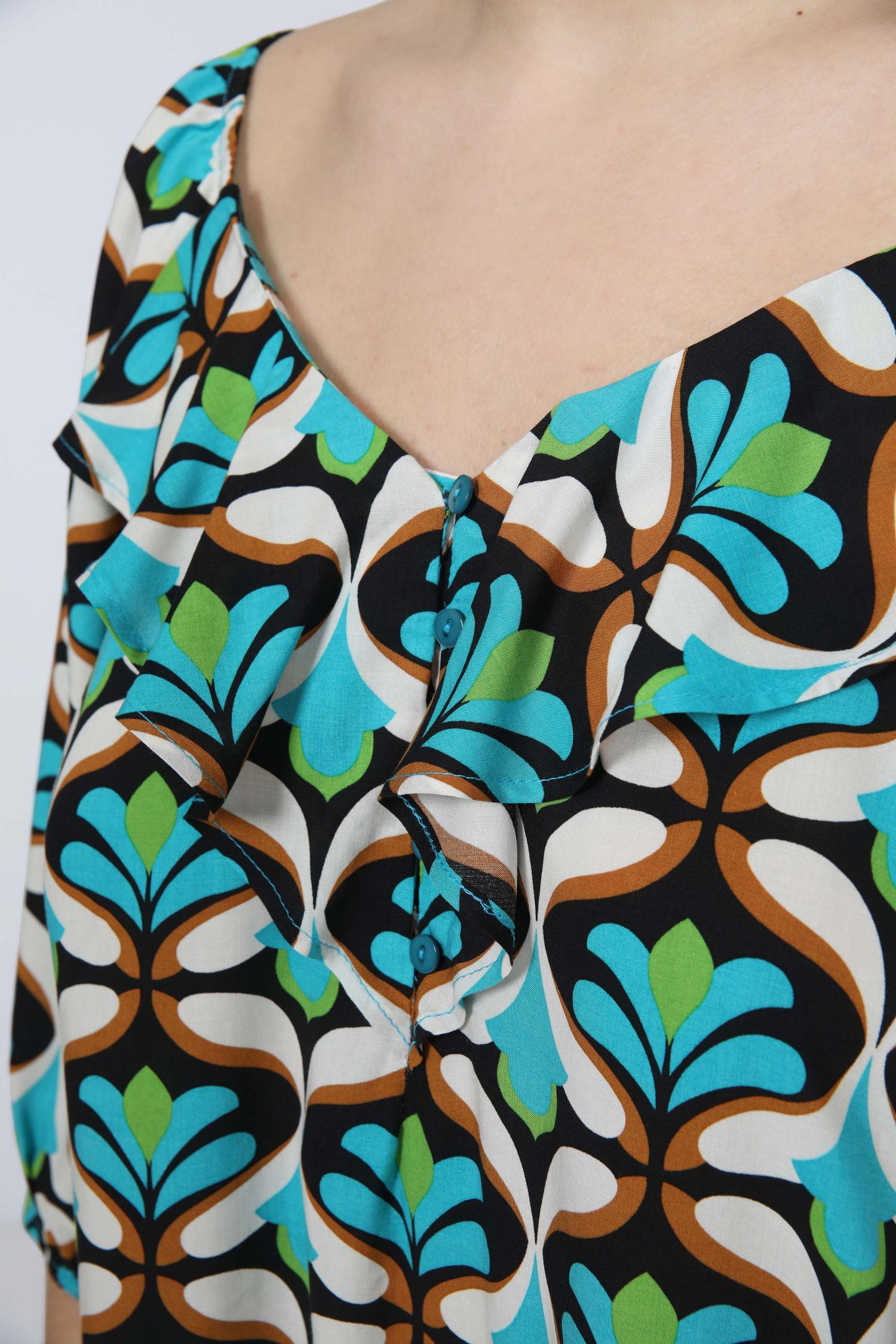 Printed blouse with cascading ruffles