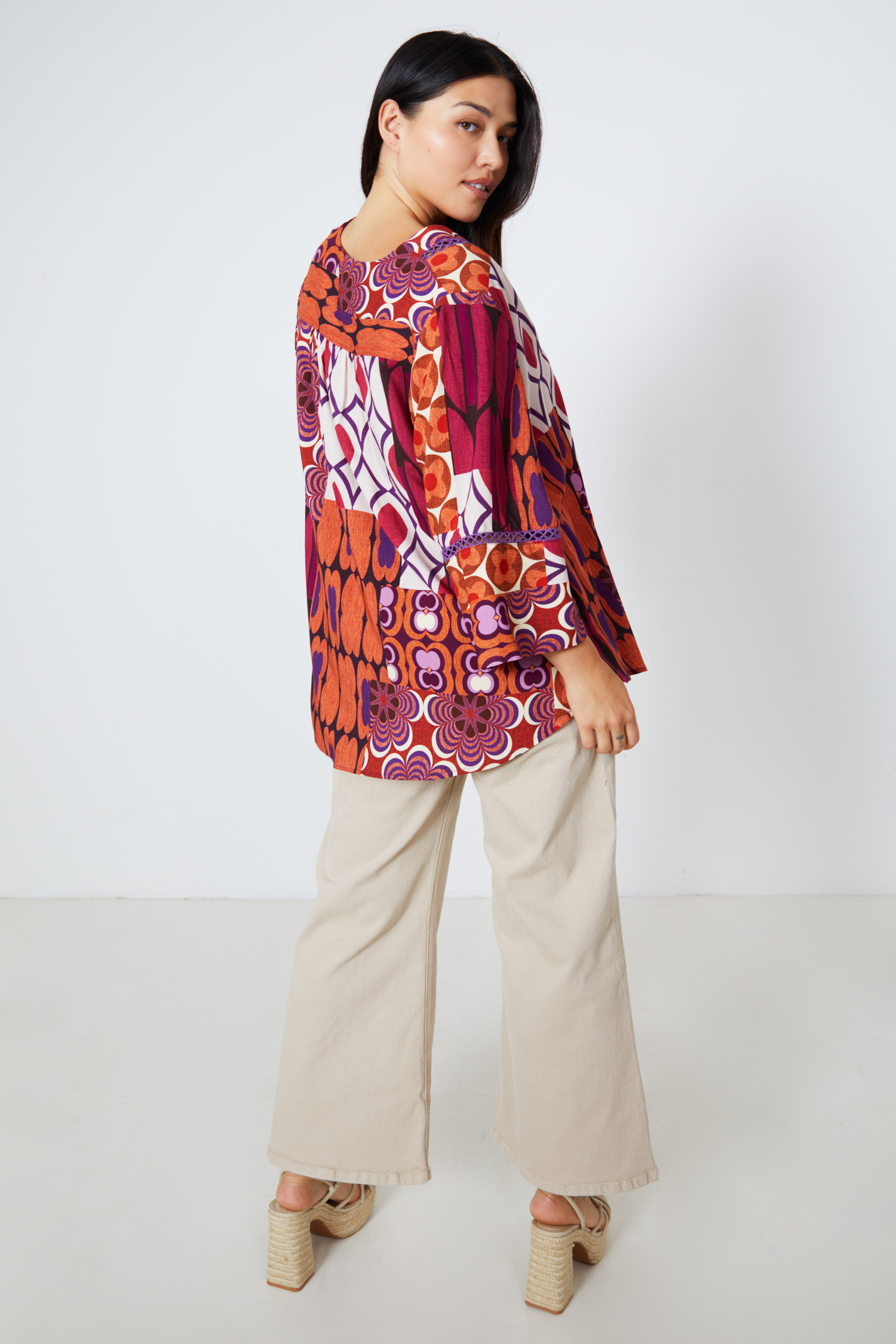 Printed blouse with braid on the sleeves