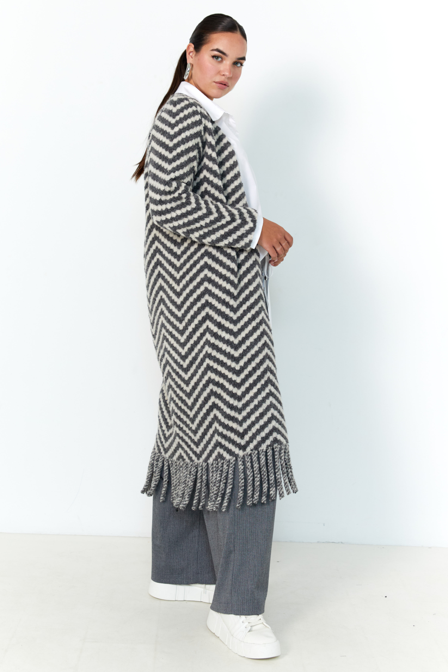 Long coat with fringes.