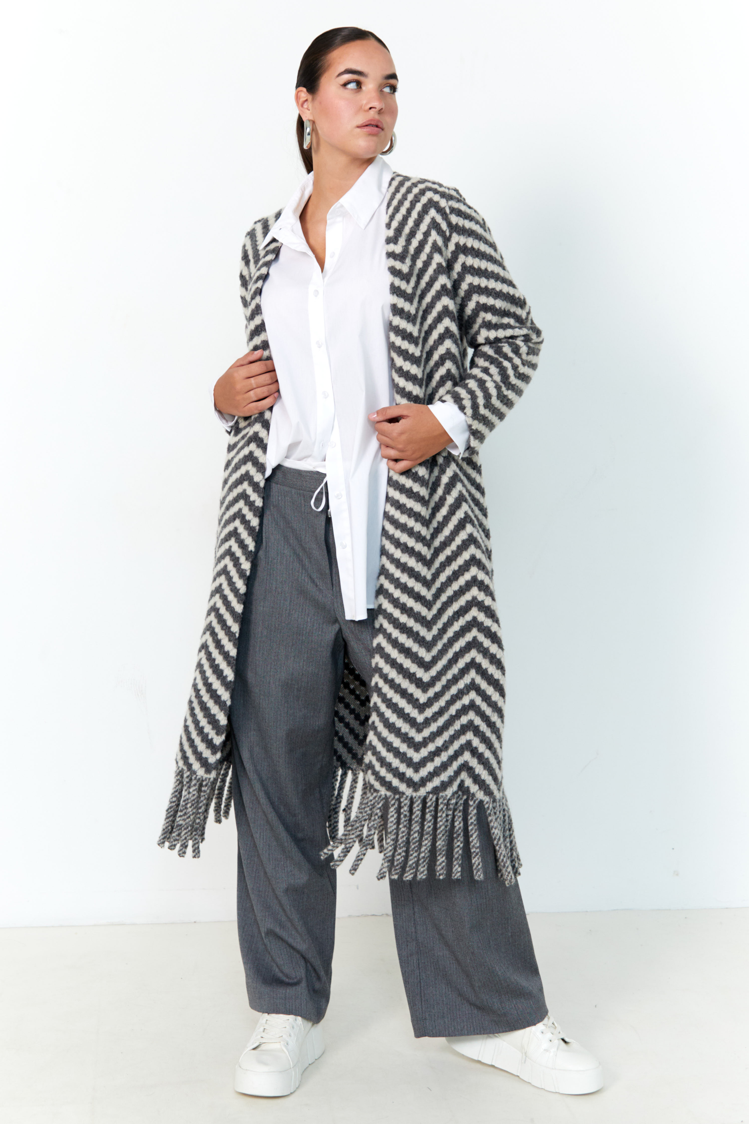 Long coat with fringes.