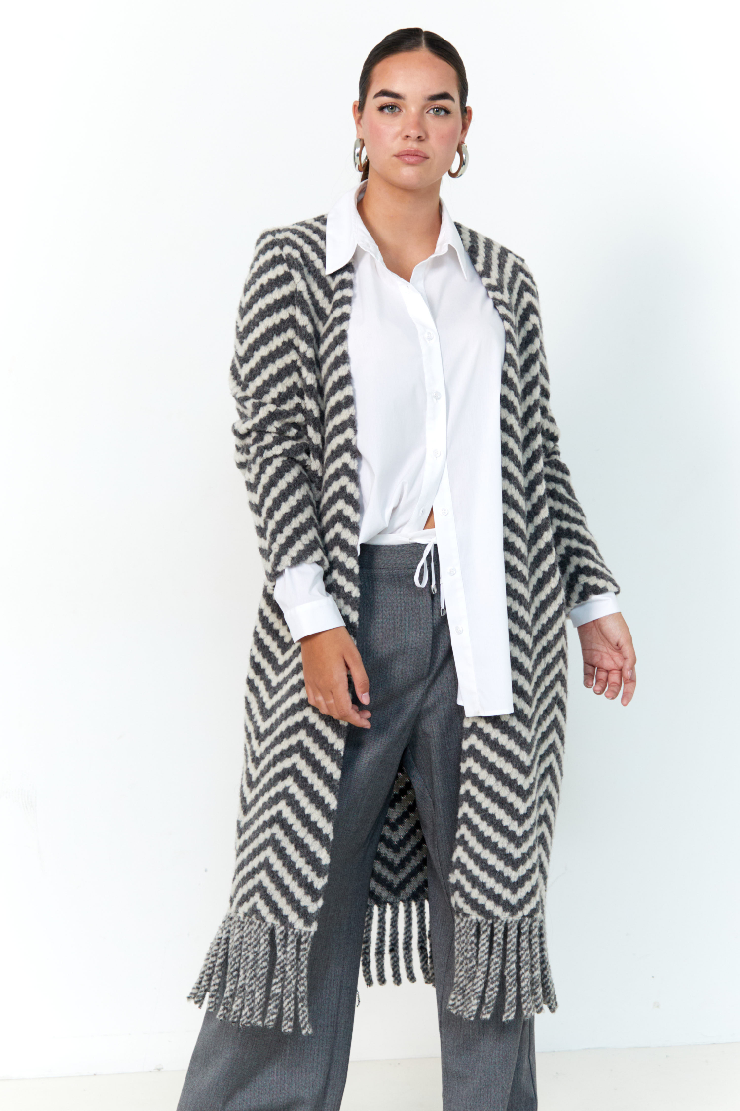 Long coat with fringes.