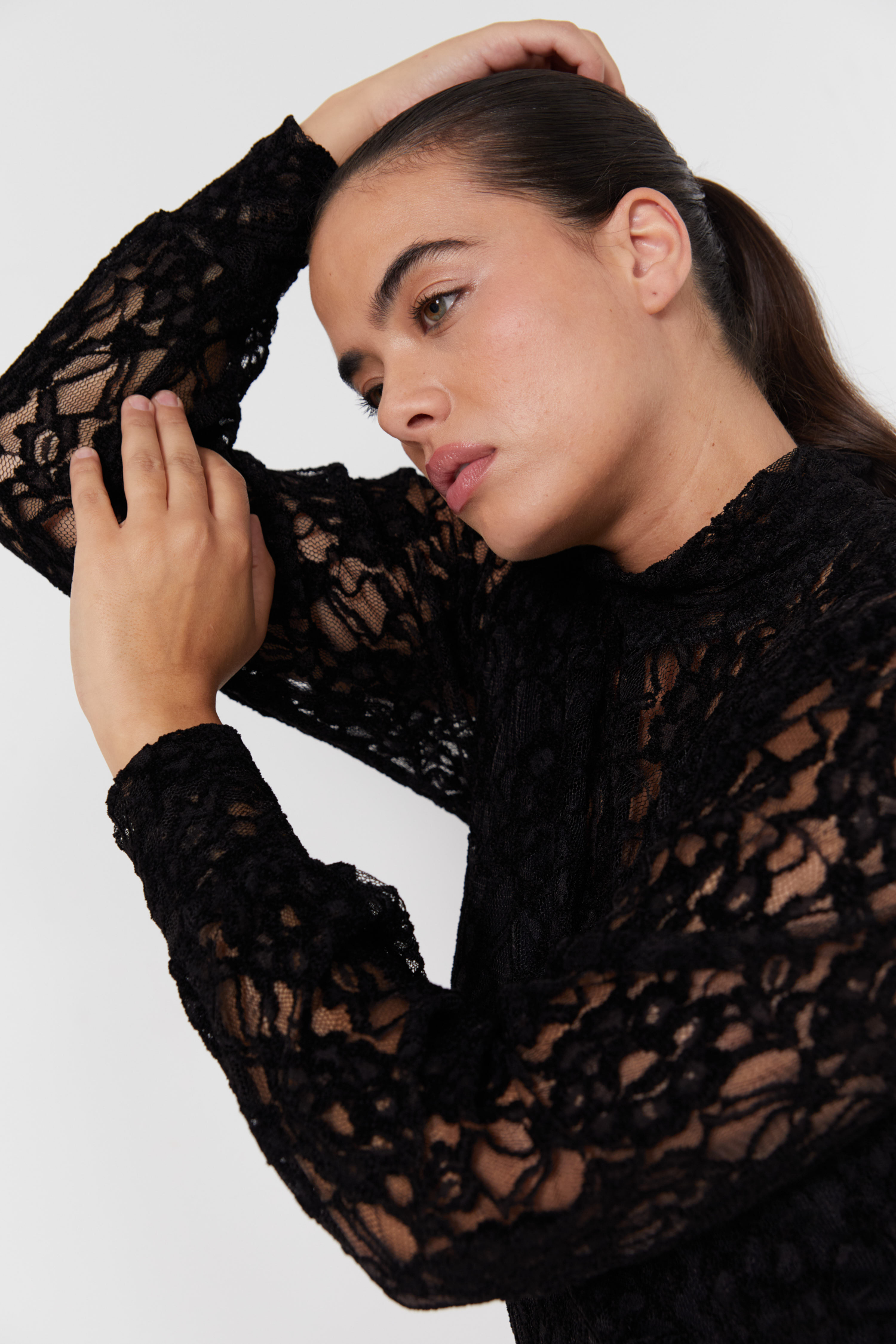 funnel neck jumper in lace with a plain top