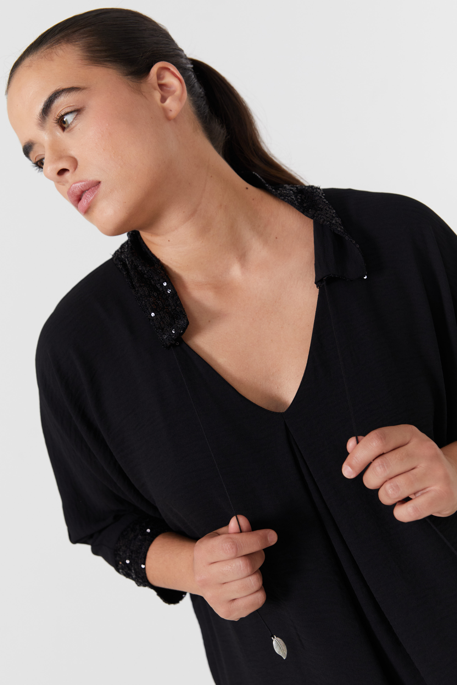 Plain blouse with sequin neckline