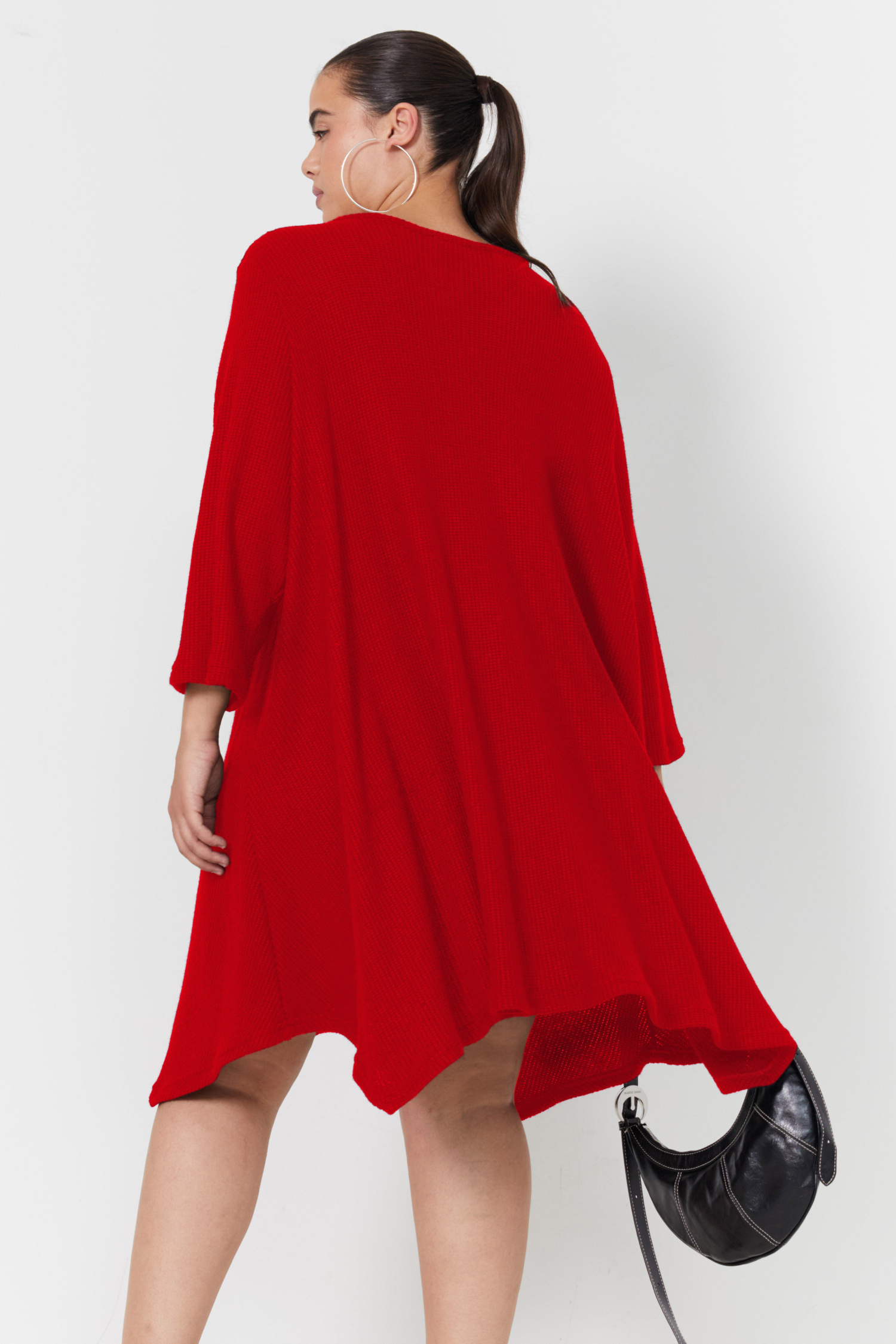 Robe forme évasée en maille nid d'abeille.