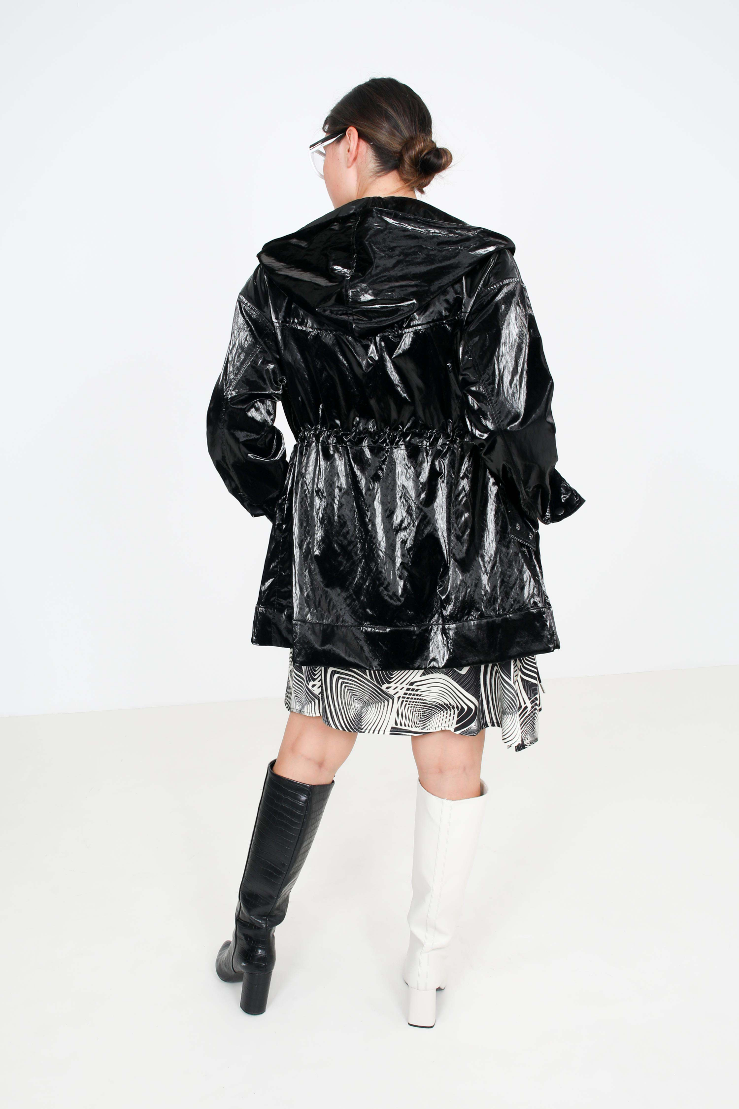 Waterproof black vinyl parka with hood.