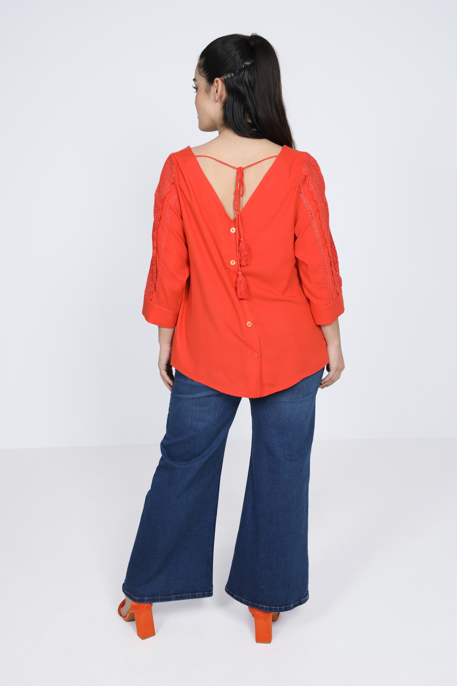 plain blouse buttoned on the back