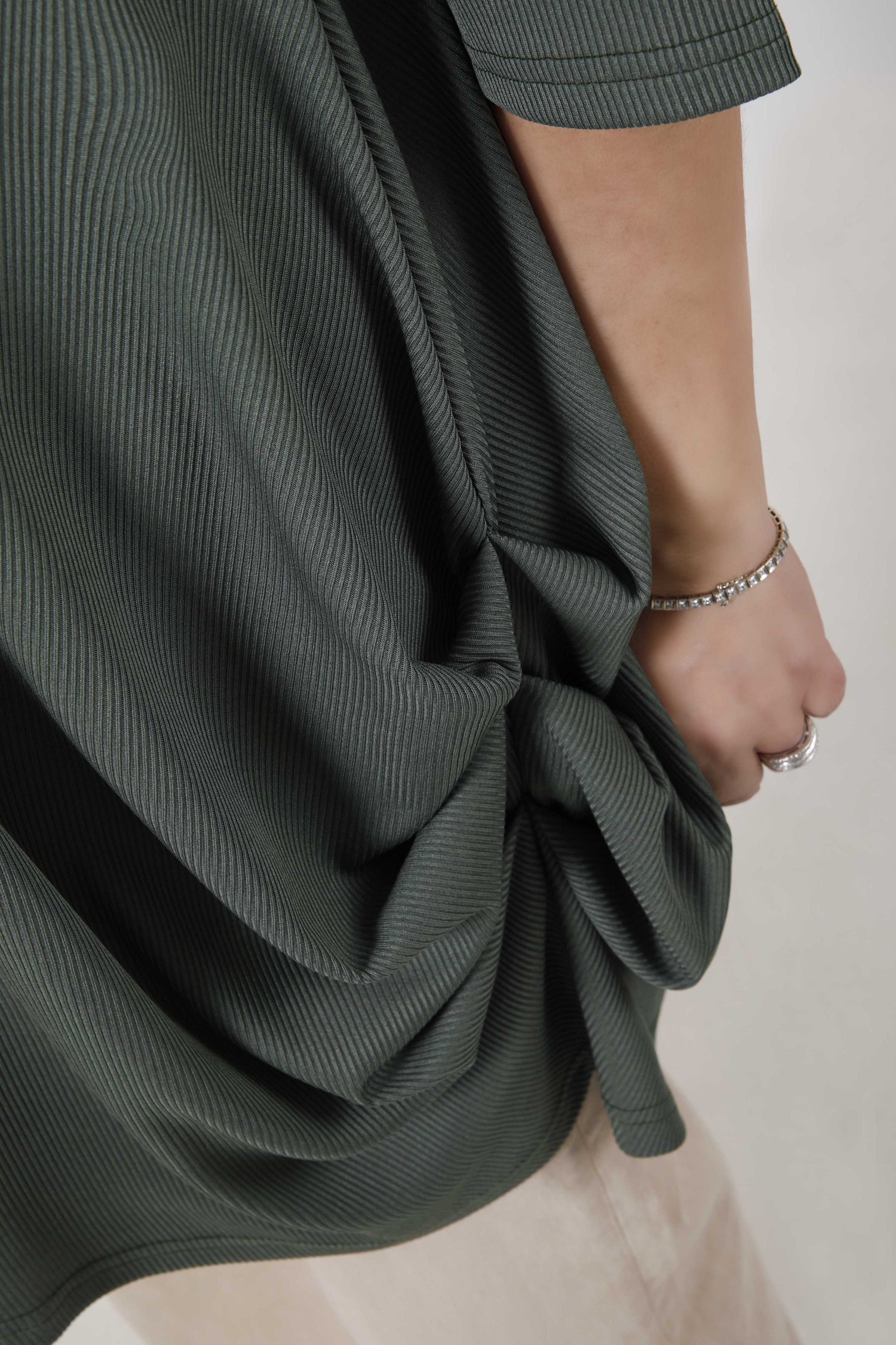 Plain knit tunic with V-neck and crisscross detailing