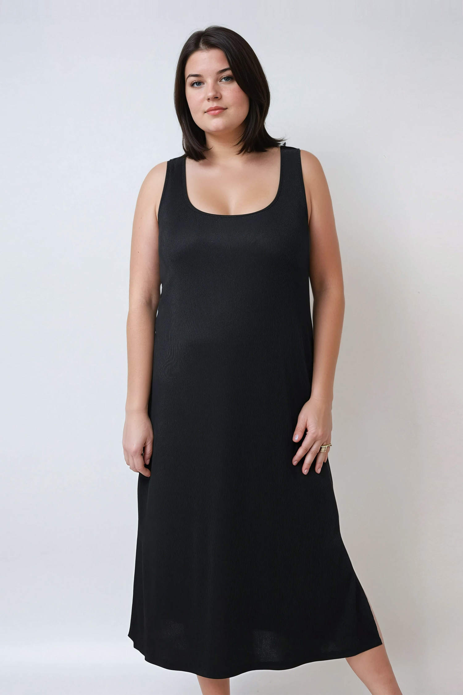Robe longue sans manche en maille côtelée.