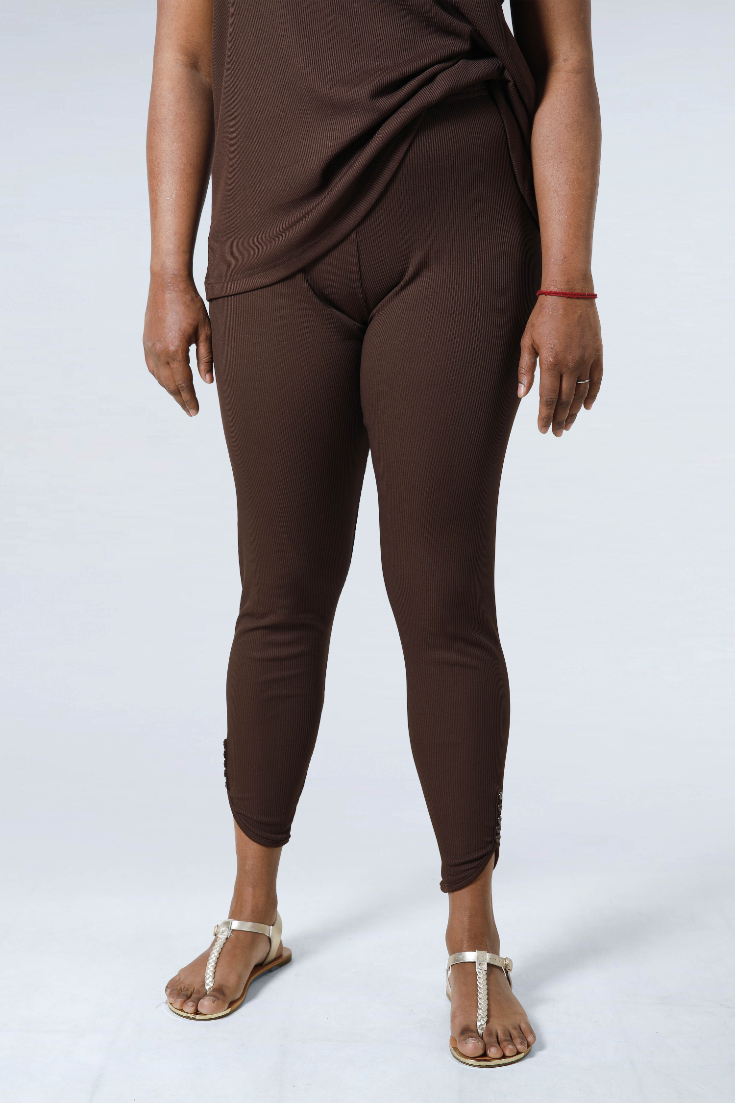 Plain knit leggings with row of buttons