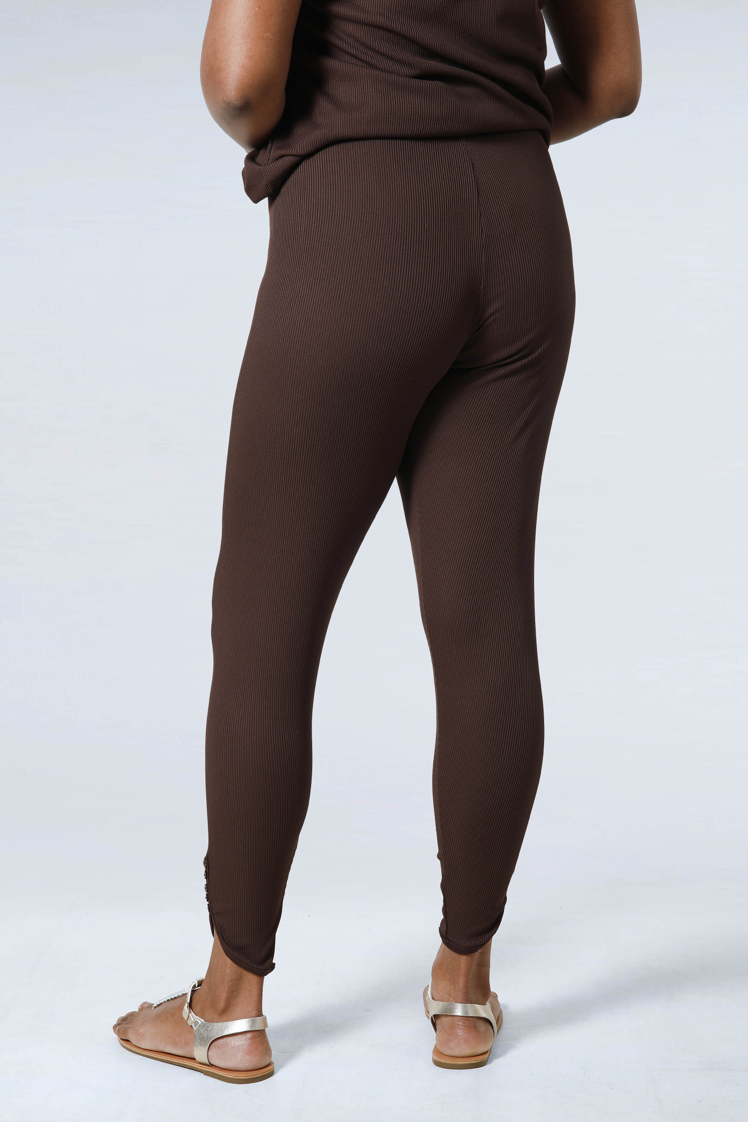 Plain knit leggings with row of buttons