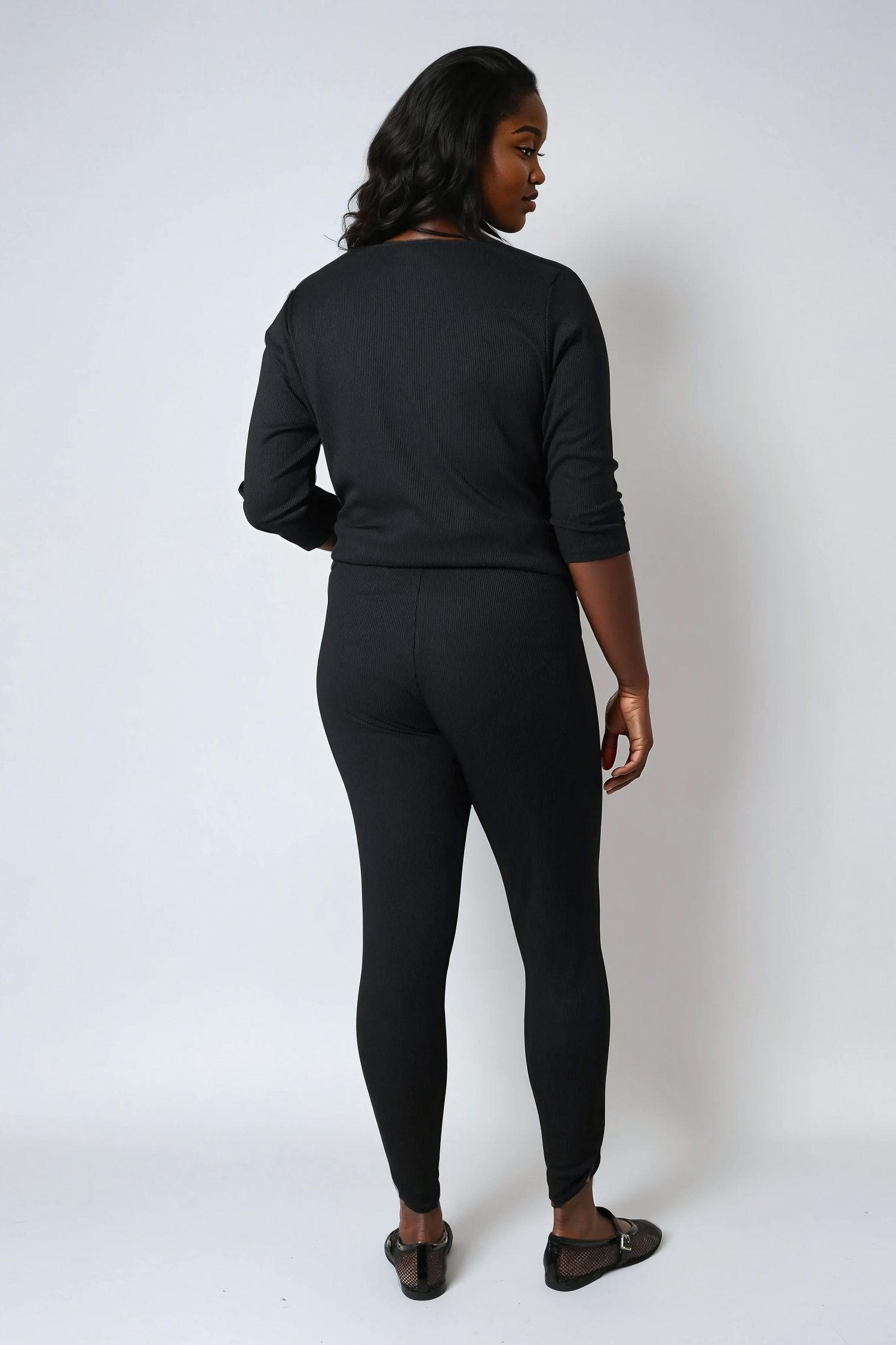 Plain knit leggings with row of buttons