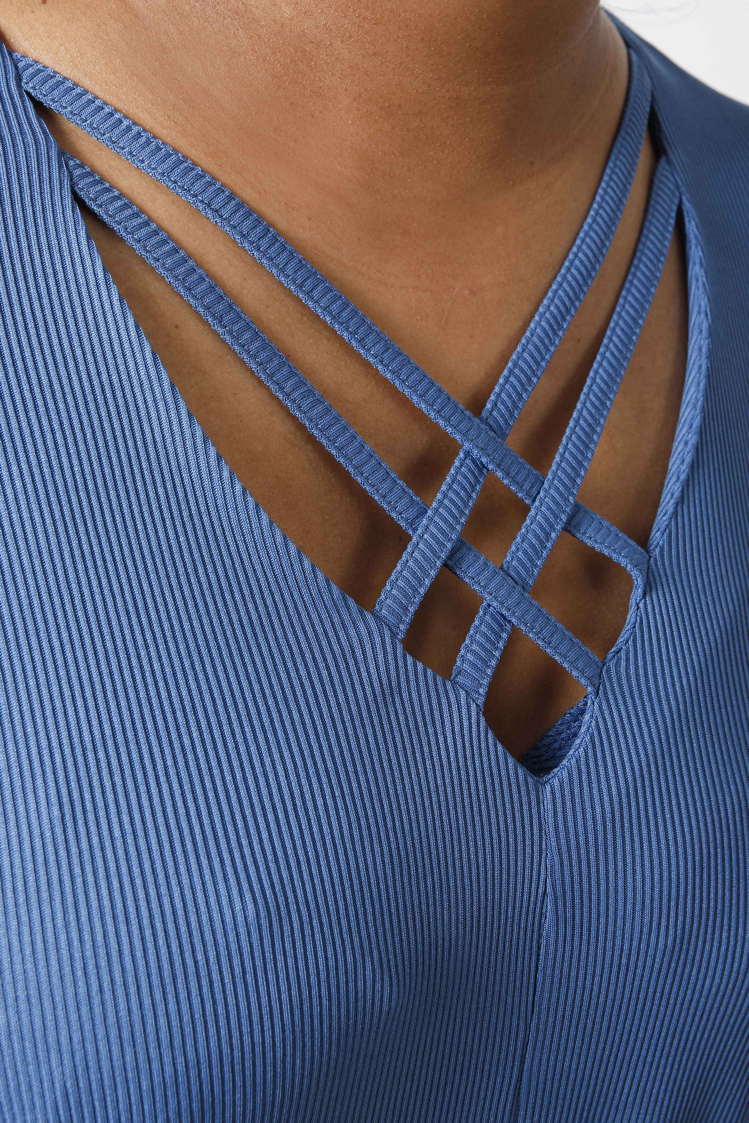 Plain knit tunic with V-neck and crisscross detailing