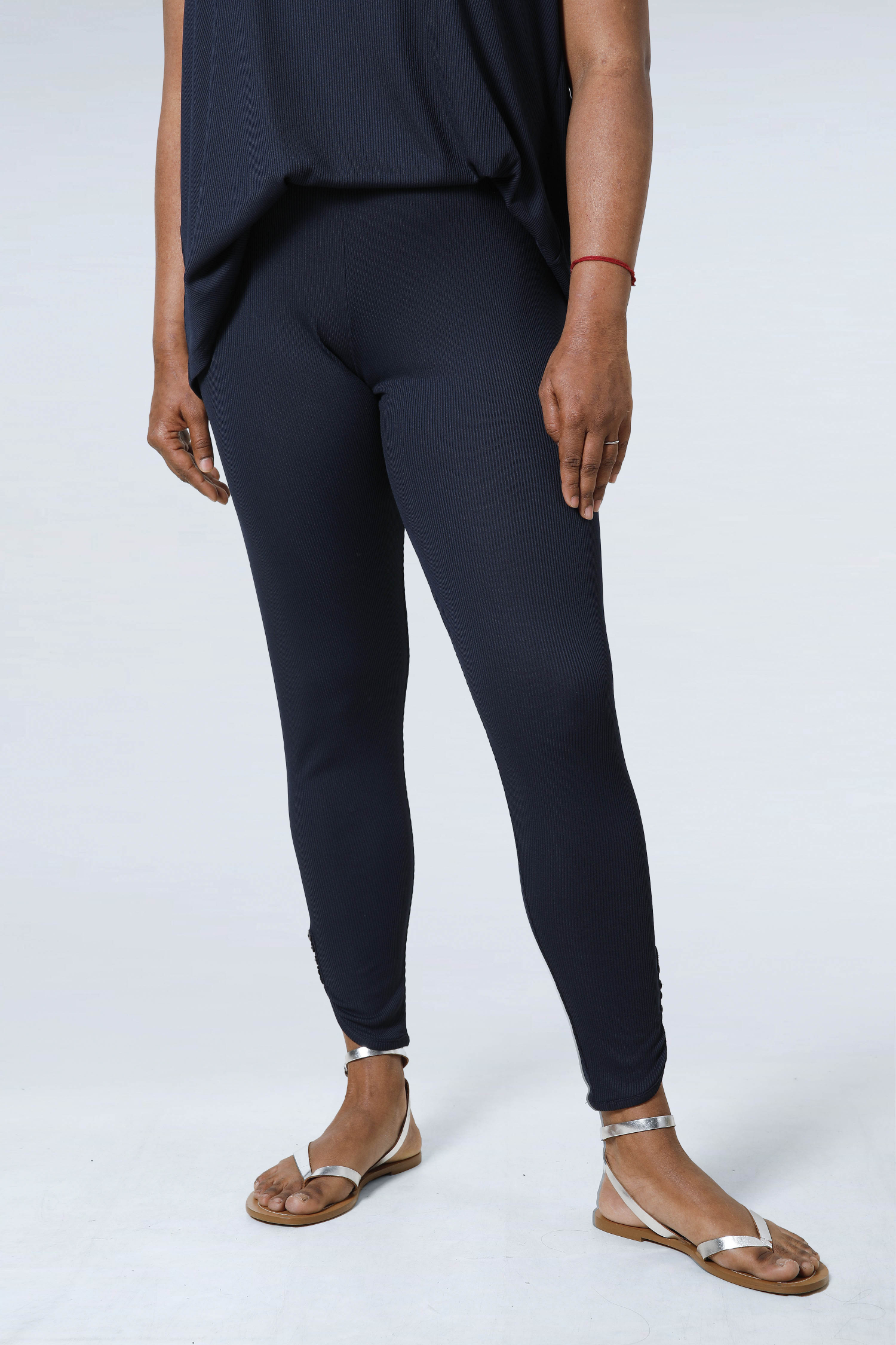 Plain knit leggings with row of buttons