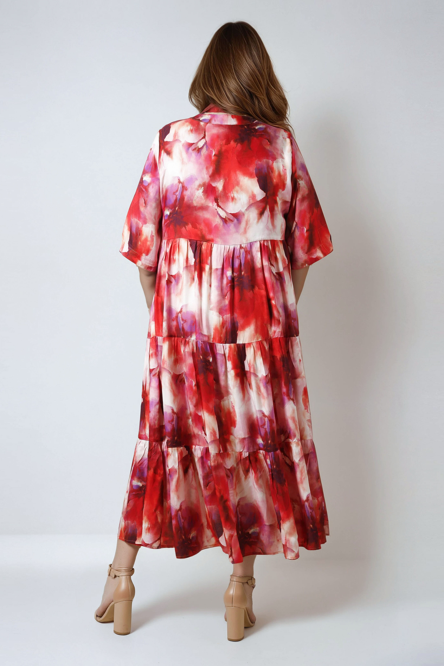 Long printed dress with a buttoned bib