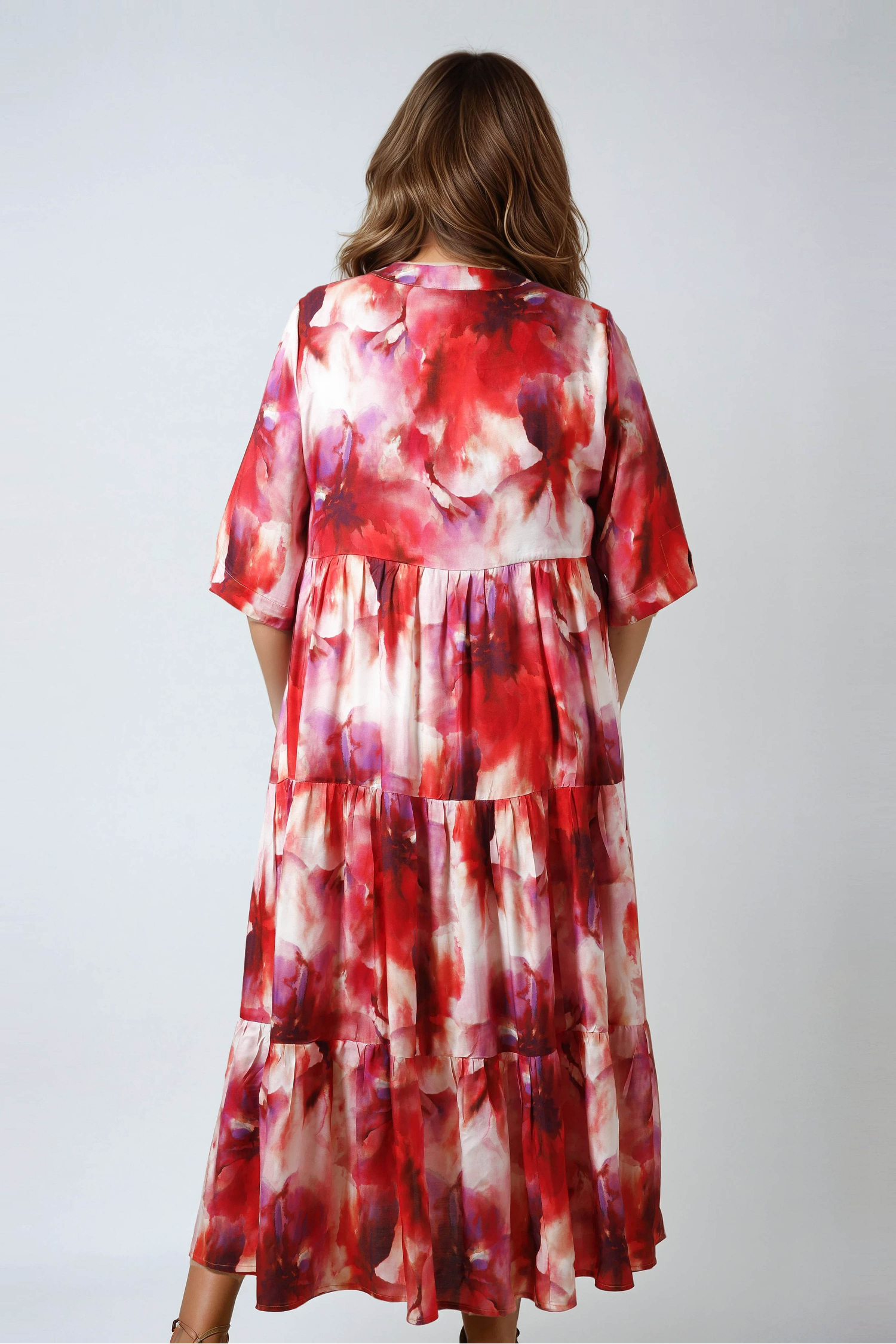 Long printed dress with a buttoned bib