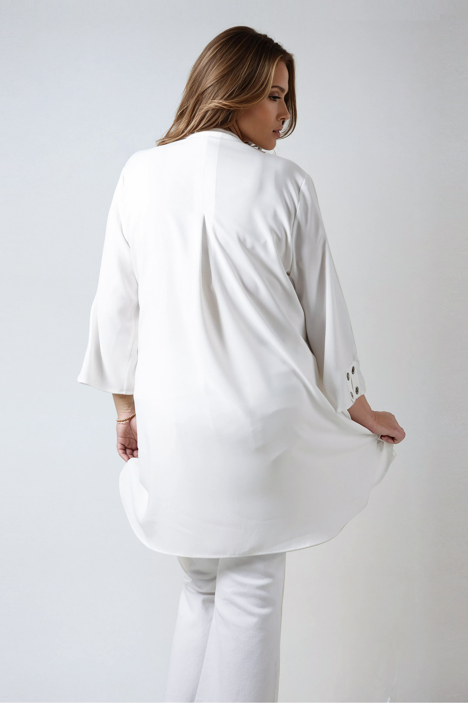 Plain tunic decorated with silver eyelets in poly viscose crepe 