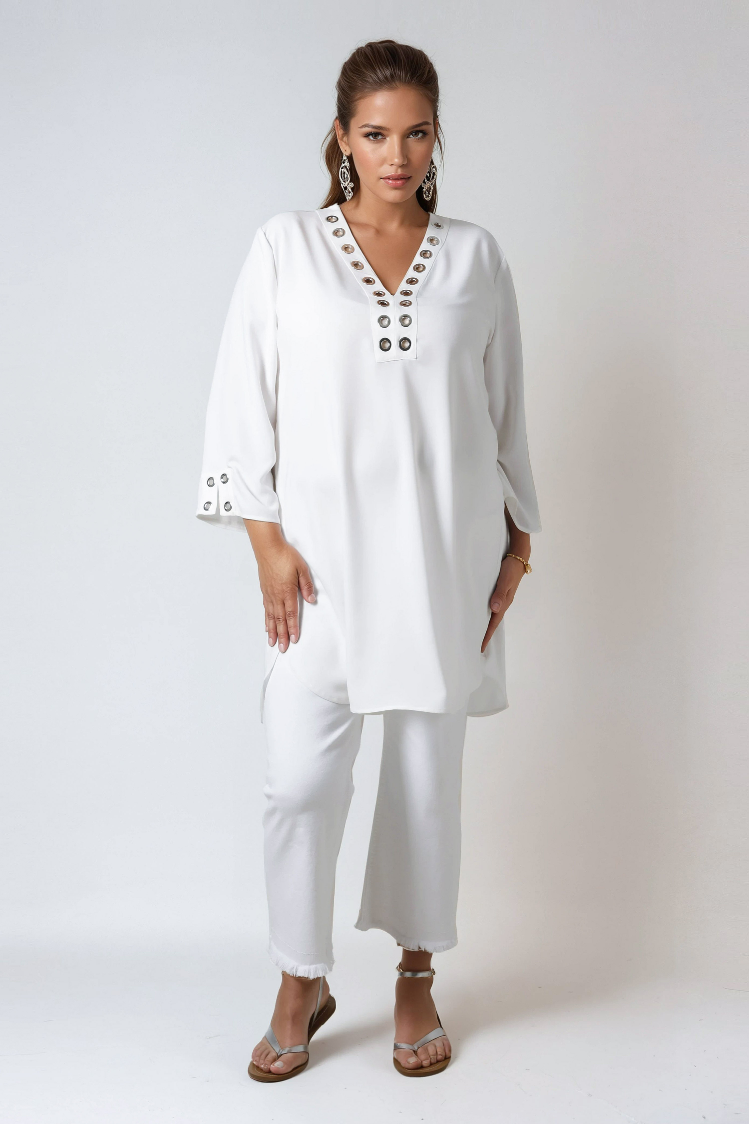 Plain tunic decorated with silver eyelets in poly viscose crepe 