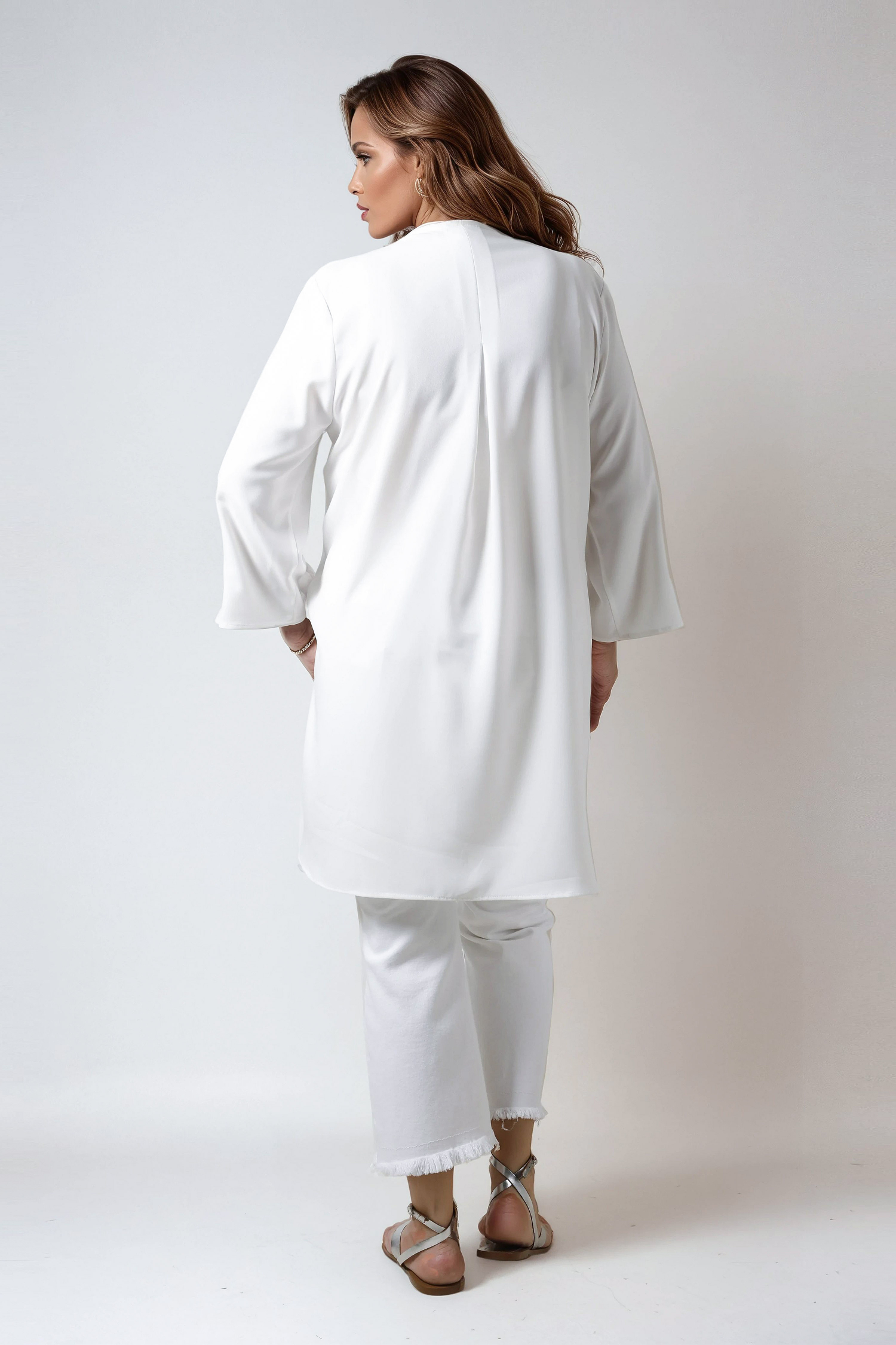 Plain tunic decorated with silver eyelets in poly viscose crepe 