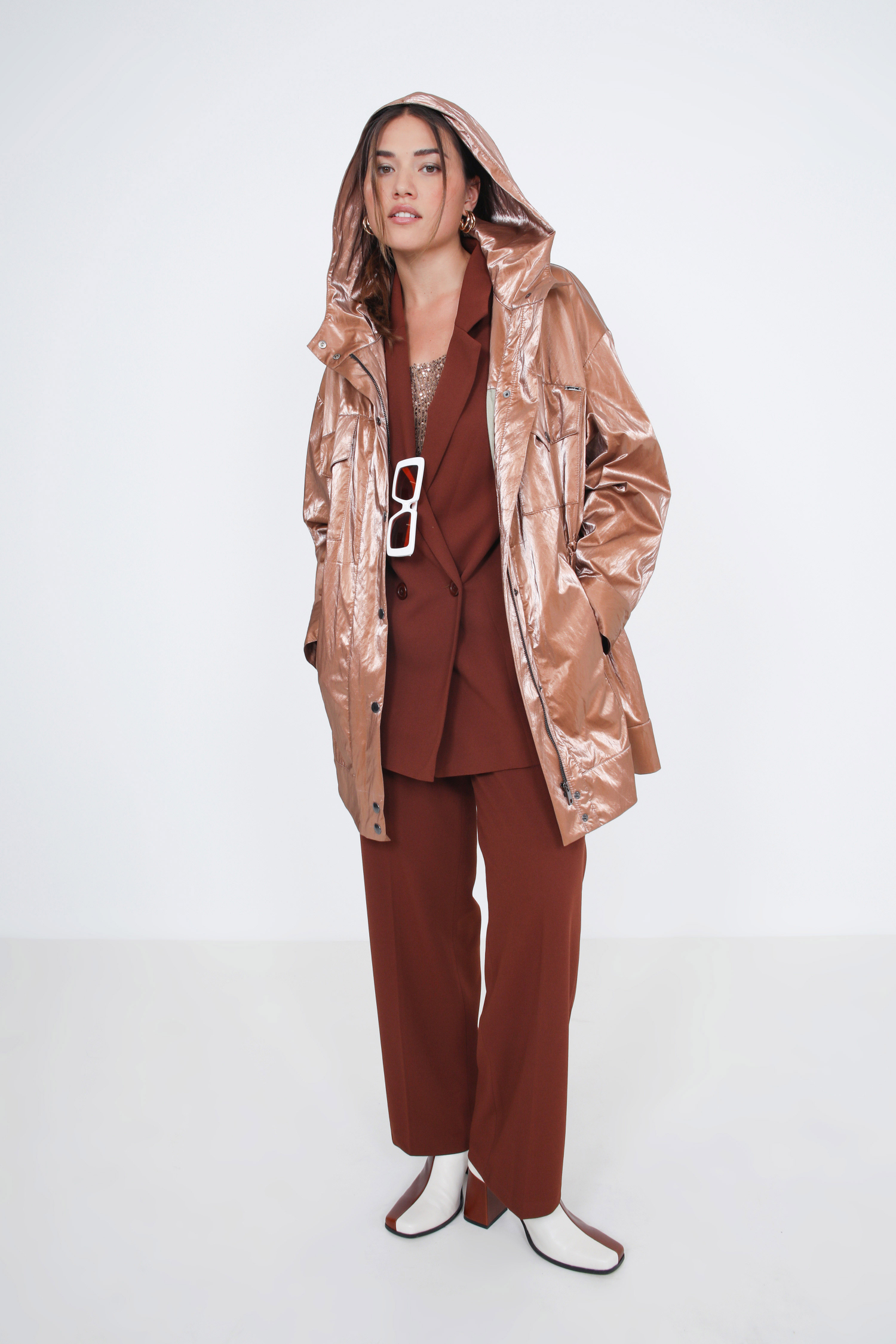 Waterproof vinyl parka with hood.