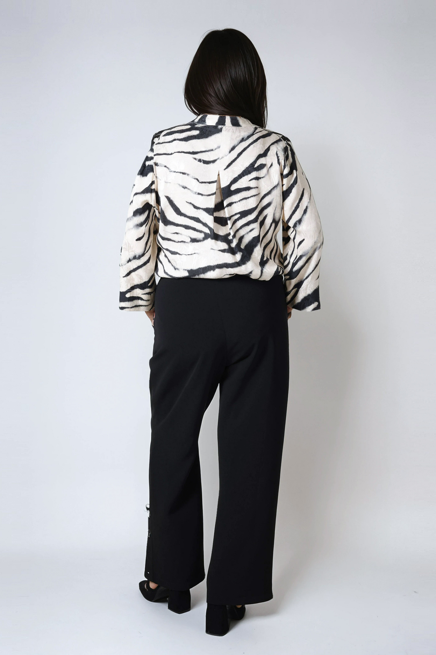 Plain tailored trousers with a decorative placket