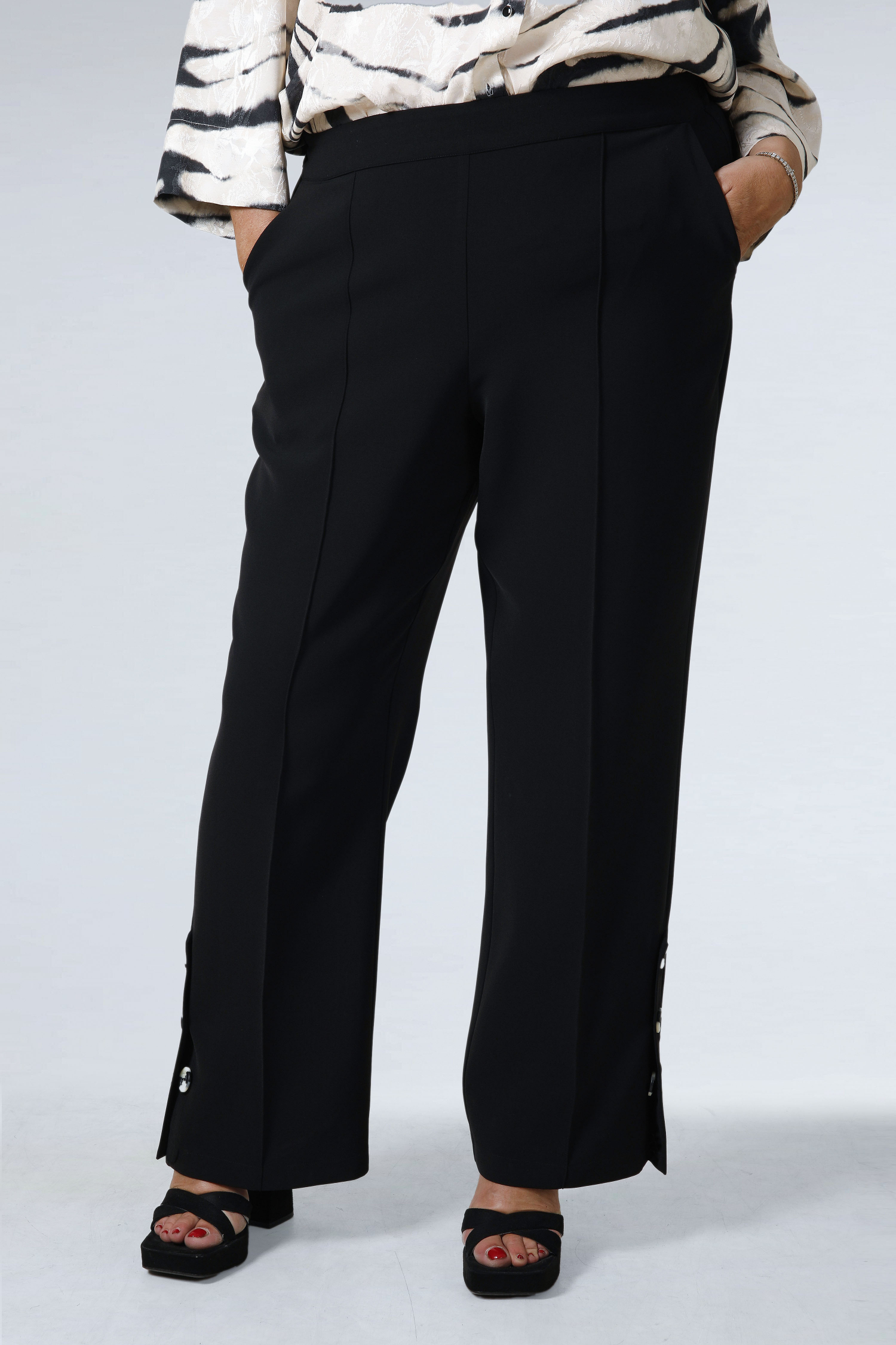Plain tailored trousers with a decorative placket