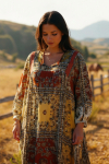 Long printed dress with a bib