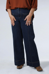 Raw flared jeans with broken crease