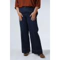Raw flared jeans with broken crease