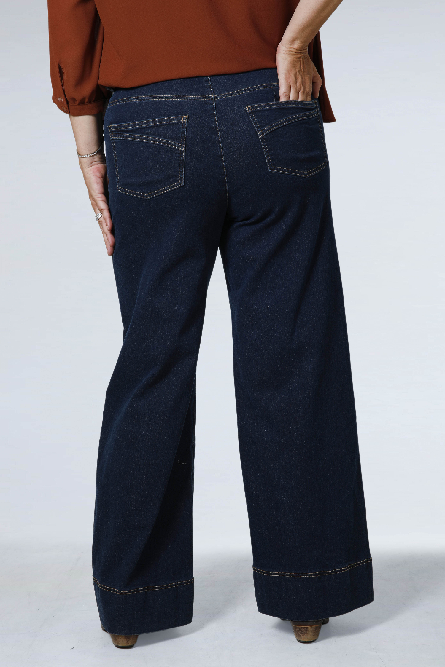 Raw flared jeans with broken crease