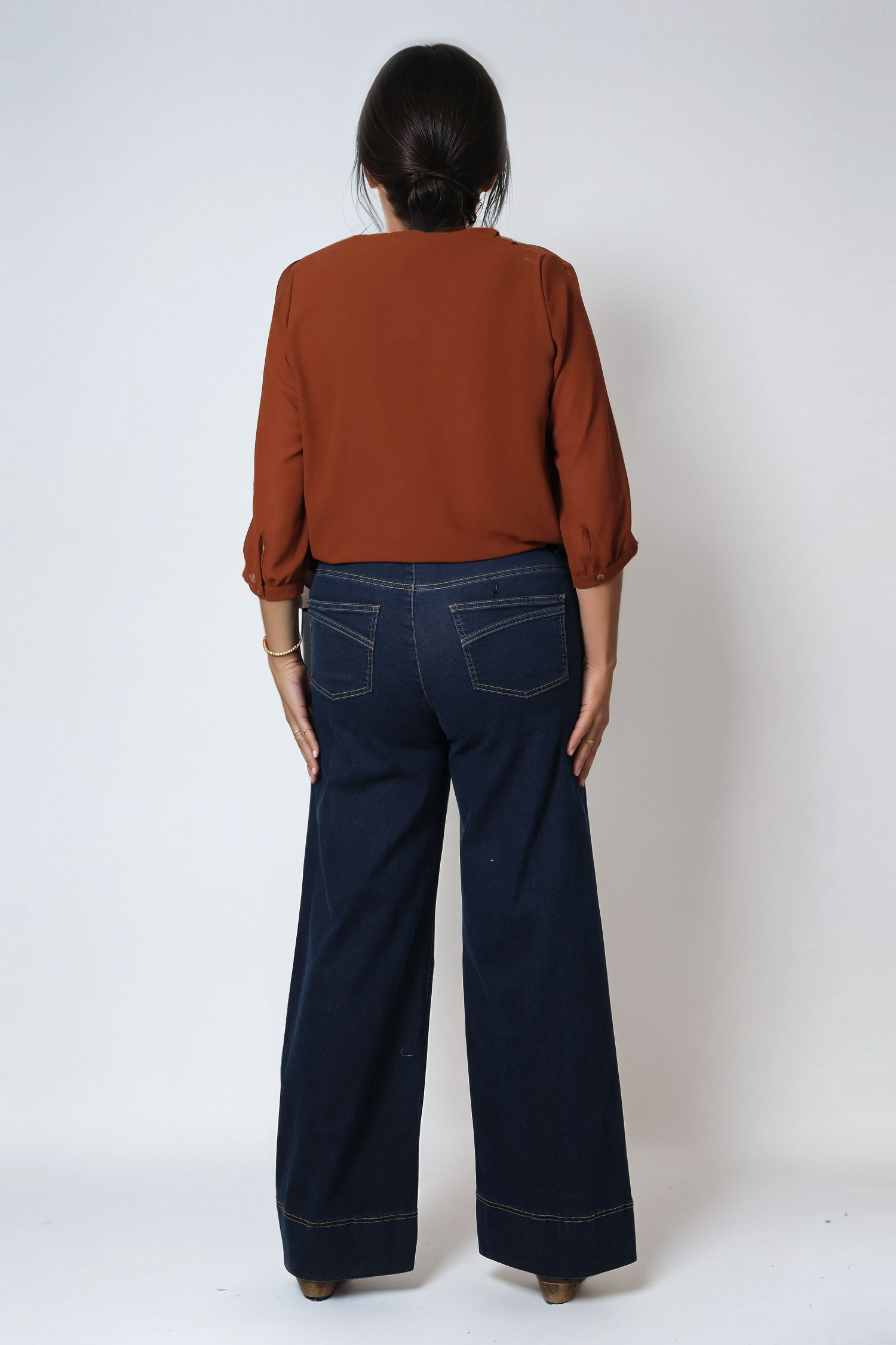 Raw flared jeans with broken crease