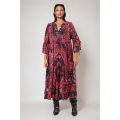 Long bohemian cashmere dress in red and black with flowing fabric and feminine ruffles