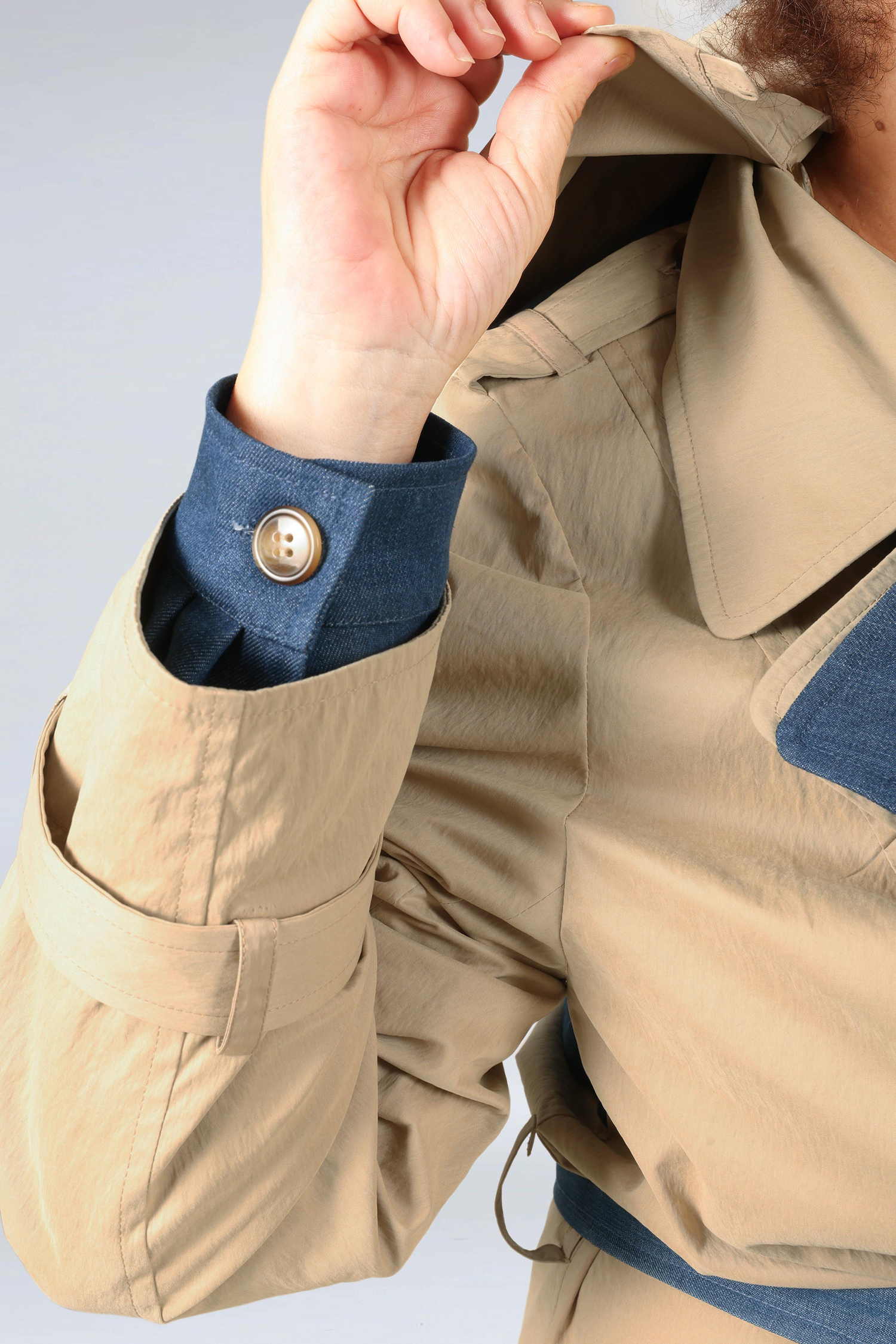 Two-material trench coat
